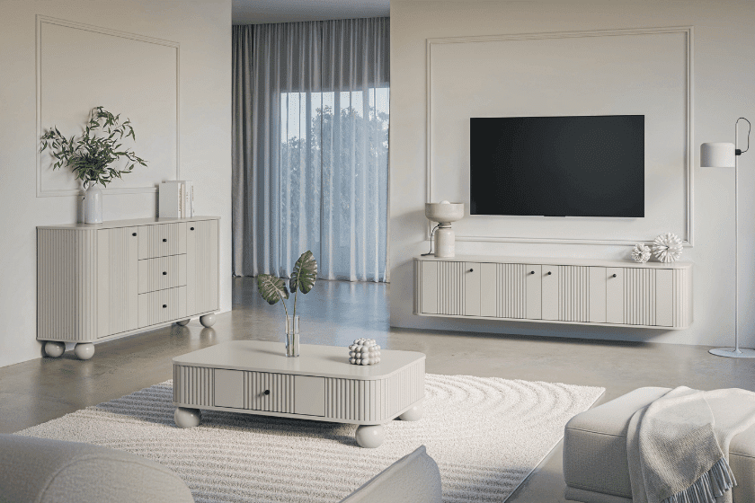 Elegancki salon w jasnych odcieniach z ryflowanymi meblami na kulistych nogach, wiszącą szafką RTV i minimalistycznym wystrojem.