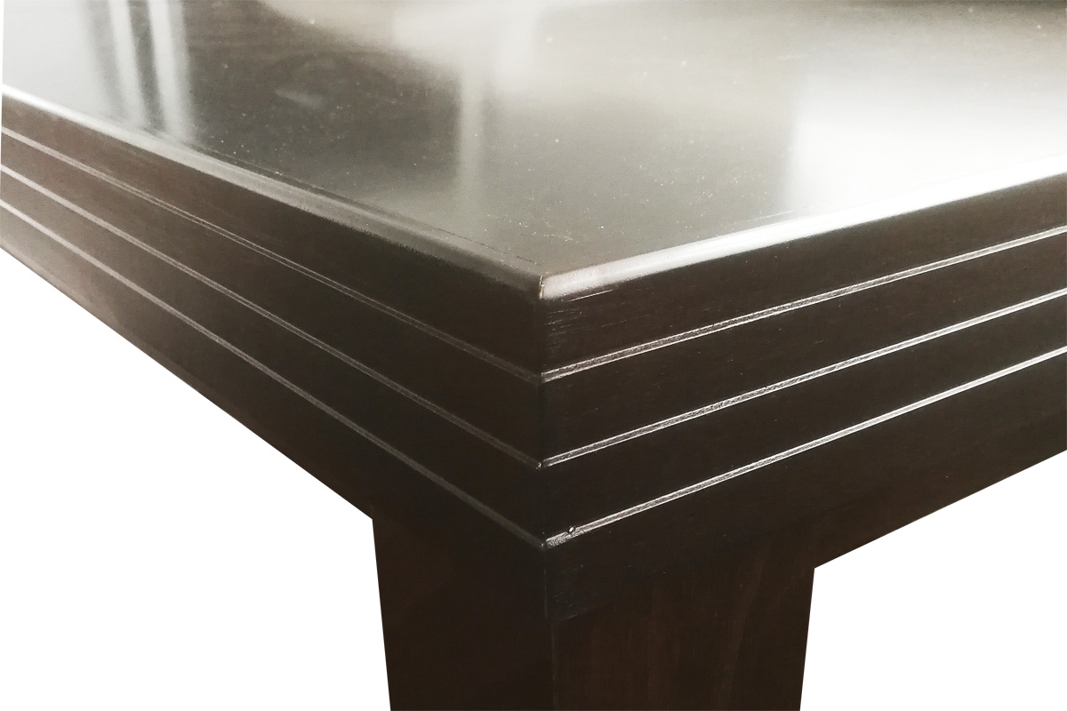 Stół rozkładany w drewnianej okleinie 140-180x80 cm Sycylia na drewnianych nogach - buk Stół rozkładany w drewnianej okleinie 140-180 cm Sycylia na drewnianych nogach - buk - detal